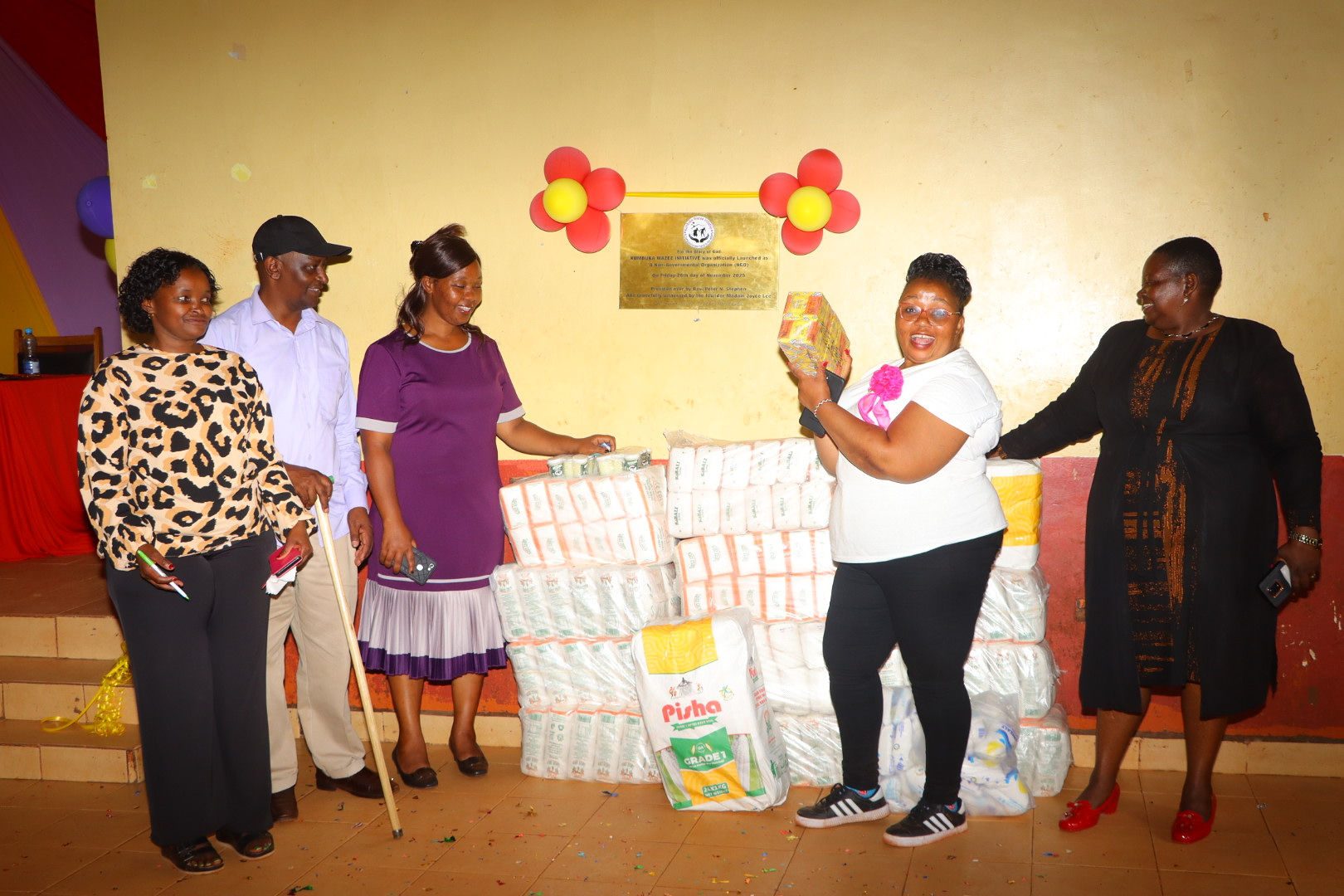 Handing over supplies at the Kumbuka Wazee Initiative launch